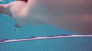 Half euro babe taking swimming classes in public pool