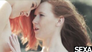 Watch these two hot redheads have wild lesbian sex on the beach
