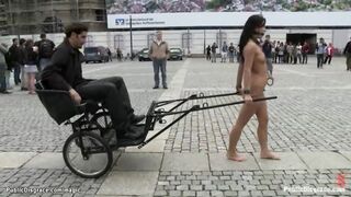 Romanian tart pulling chariot in public