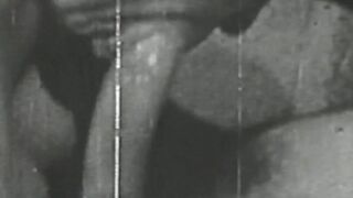 Black & white vintage video of lady sucking her lover