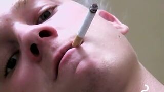 Twink savors the pleasure of smoking & stroking shaft