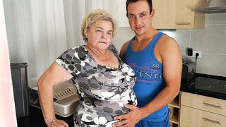 Buxom grandma sucking & fucking a way younger dude in her kitchen