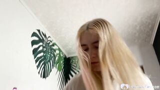 Blonde girl is on her knees & giving a blowjob